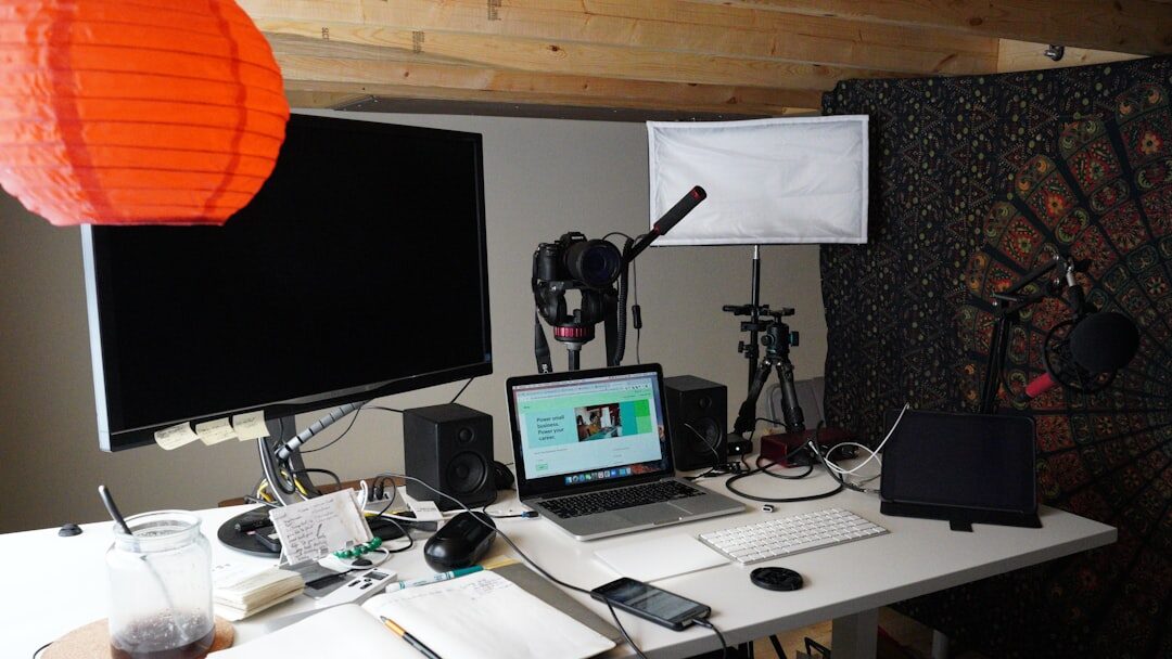 Director desk with broadcast equipment and screens