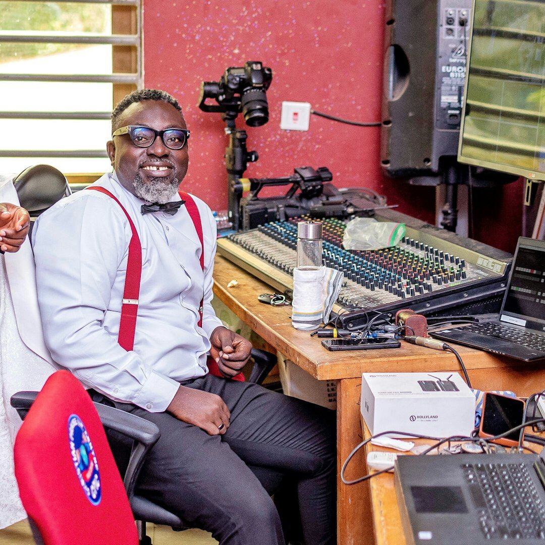 Professional male broadcast trainer in business attire